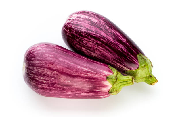 istock Fresh eggplants, aubergine on a white background. 871763218