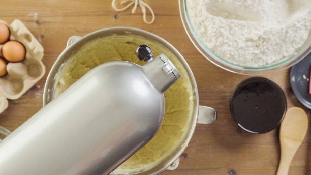 istock Mixing dough for double batch of gingerbread cookies. 871764196