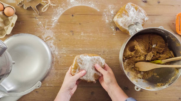 istock Mixing dough for double batch of gingerbread cookies. 871764272