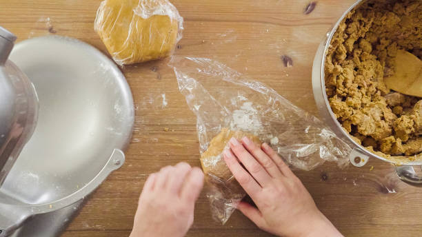 istock Mixing dough for double batch of gingerbread cookies. 871764448