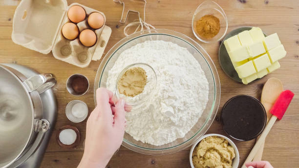 istock Mixing dough for double batch of gingerbread cookies. 871764472