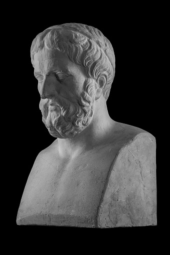 White plaster bust sculpture portrait of a man with a beard