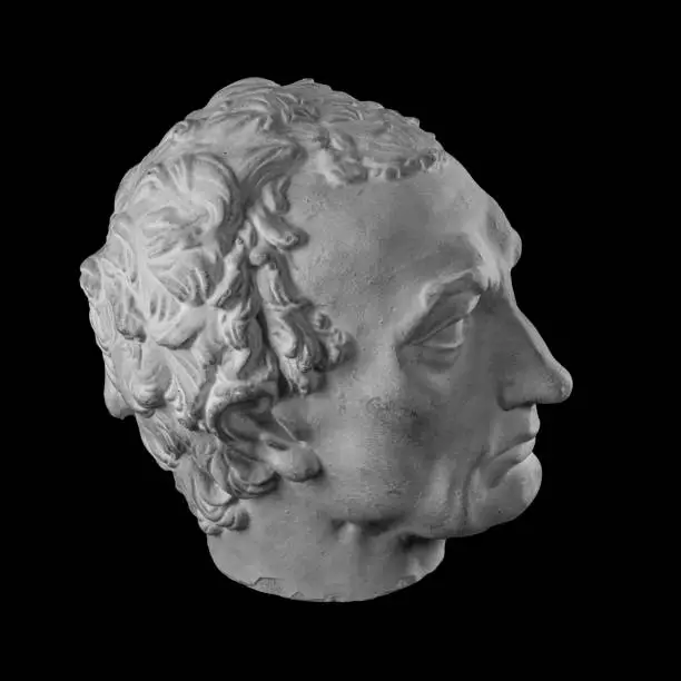 Photo of White plaster bust sculpture portrait of a man