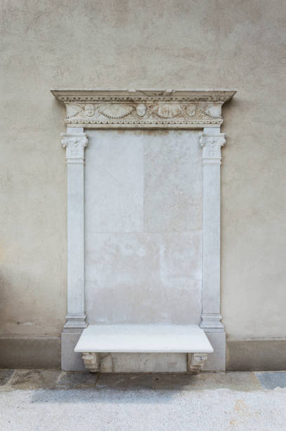 istock Sculpture of angel heads on a stone wall, architectural feature, frame concept 871774416