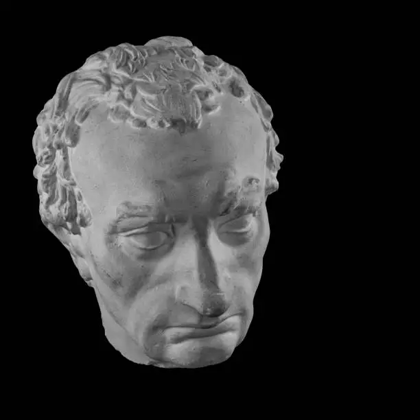 Photo of White plaster bust sculpture portrait of a man