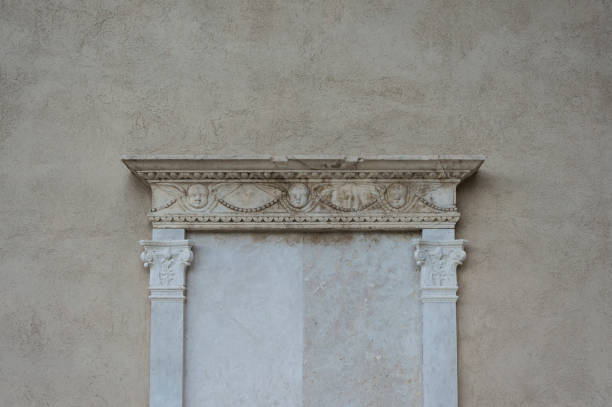 istock Sculpture of angel heads on a stone wall, architectural feature, frame concept 871774522