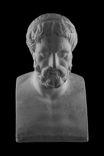 White plaster bust sculpture portrait of a man with a beard