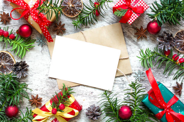 istock christmas blank greeting card in frame of fir branches, decorations, gift boxes and cones 871789448