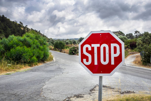 istock STOP warning traffic sign on a road 871793828