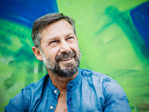 istock Portrait of mature man, graffiti on background 871798058