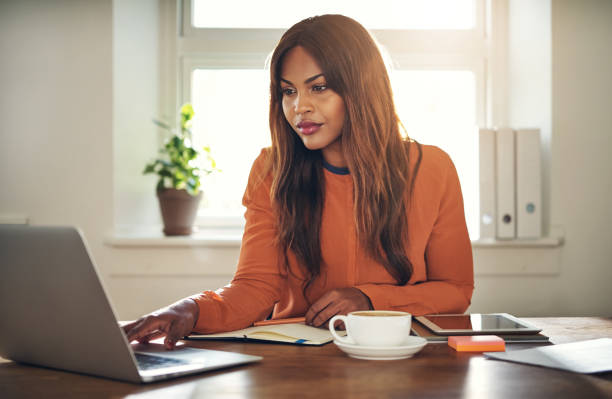 istock Focused young entrepreneur hard at work in her home office 871802028