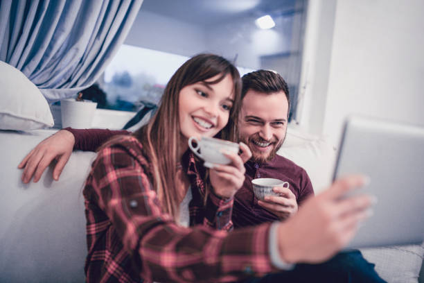 istock Couple Taking selfie With Digital Tablet At Home 871802446
