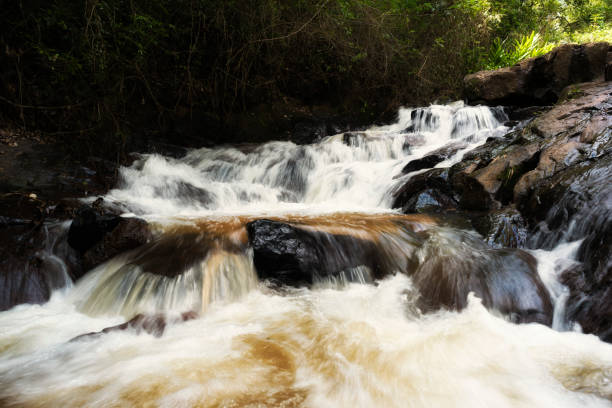 istock Waterfall with golden sand riverbed 871802594