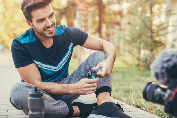 istock Sportsman doing a vlog about smart watches 871808148
