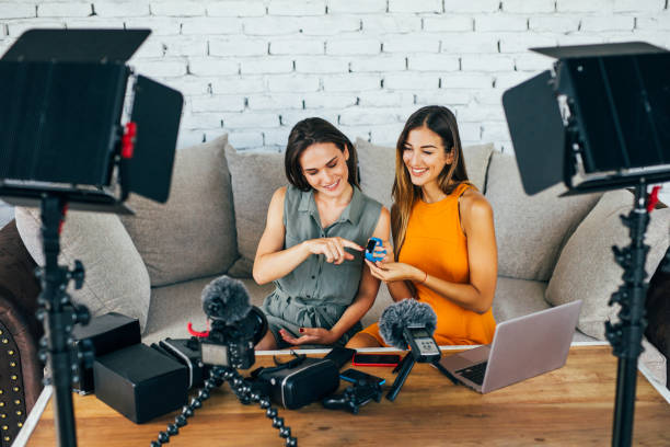 istock Two women reviewing smart watches 871808162