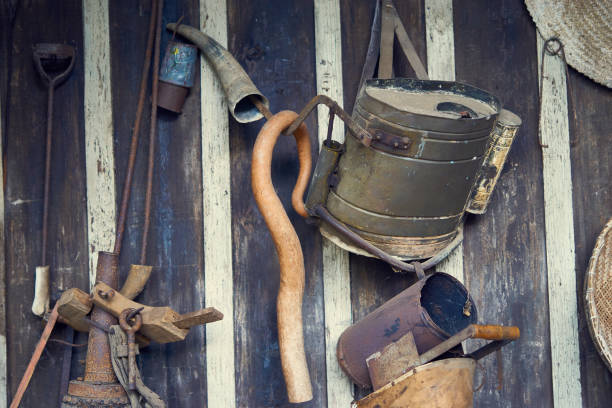 istock Old agricultural tools hanging on the wall as decoration. 871808422