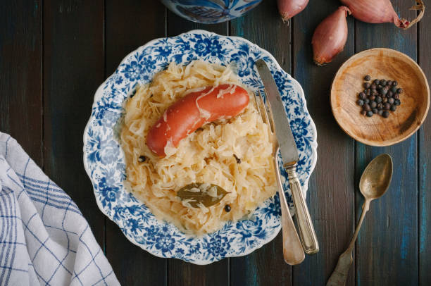 Blue plate with sauerkraut and sausage