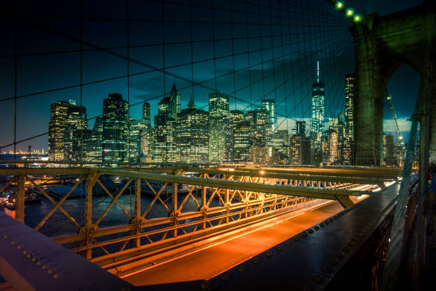 istock Light trails and city lights view from Brooklyn Bridge. 871812934