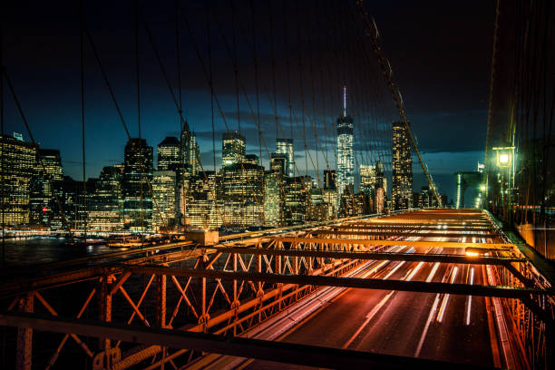 istock Light trails and city lights view from Brooklyn Bridge. 871813054