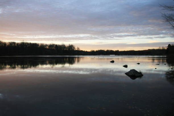 istock Beautiful forest lake sunrise in November. 871815706