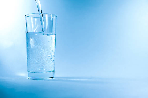 istock Glass of water in blue 871815780