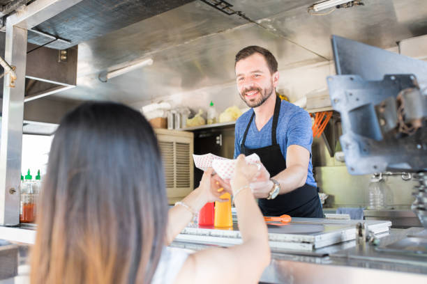 istock Food truck owner enjoying his work 871819630