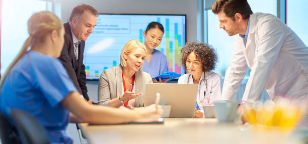 istock hospital administrator with medical team 871820250
