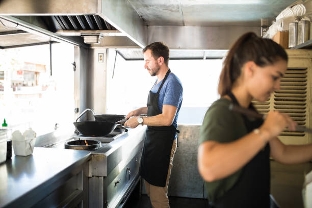 istock Workers cooking food in a truck 871820648