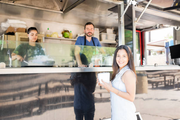 istock Happy diner next to a food truck 871822746