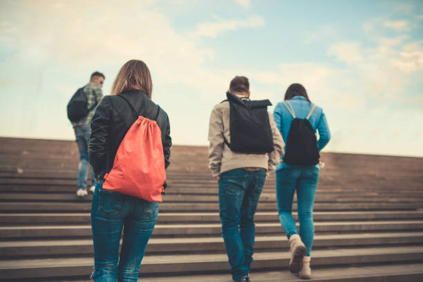 istock Group of Students with Backpacks Walking to School 871822748