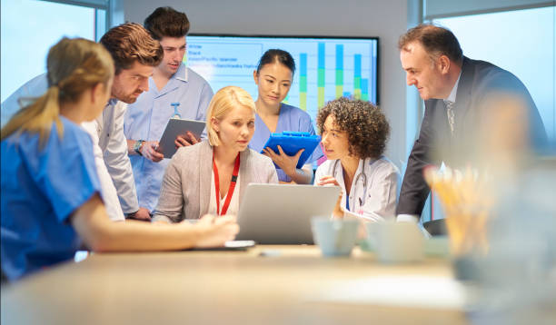 istock pharmaceutical rep with medical team 871822796
