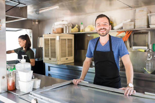 istock Happy worker in a food truck 871822874