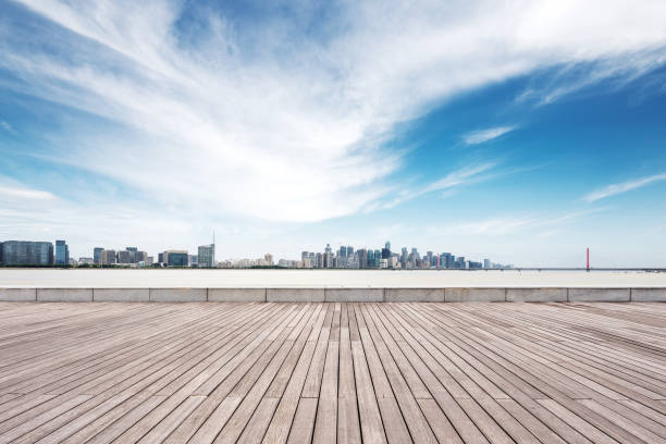 istock empty wooden floor with modern bridge and buildings 871823618