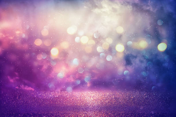 istock Purple glitter lights background. defocused. 871824198