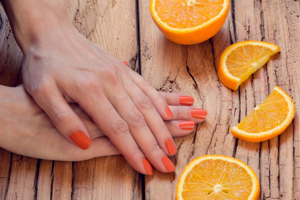 istock orange manicure and oranges 871824346
