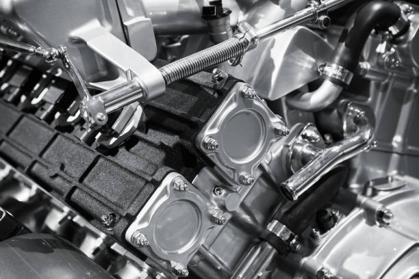 istock V12 car engine fragment, closeup photo 871824384
