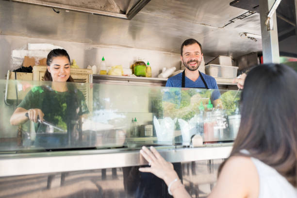 istock Cooks working in a food truck 871824486