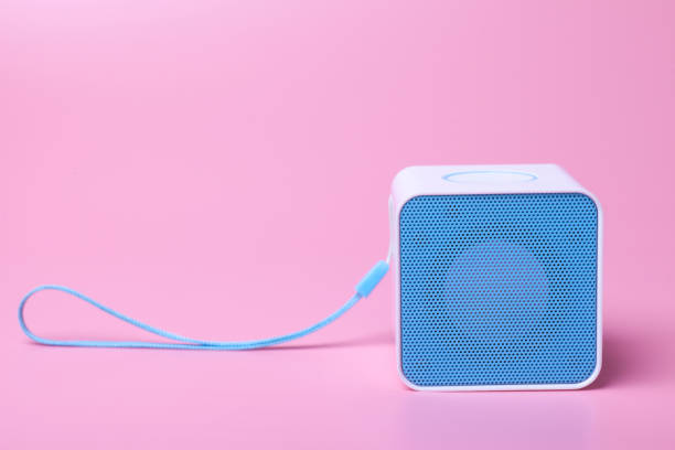 istock blue music speaker on purple background 871827702