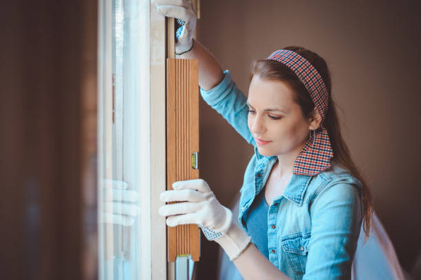 istock Beautiful woman redecorating home 871830876