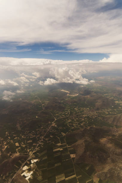istock Clouds and Sky as Seen Through Window of an Aircraft 871831378