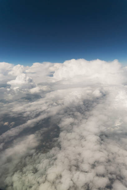istock Clouds and Sky as Seen Through Window of an Aircraft 871831382