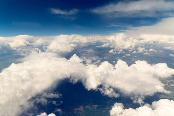 istock Clouds and Sky as Seen Through Window of an Aircraft 871831444