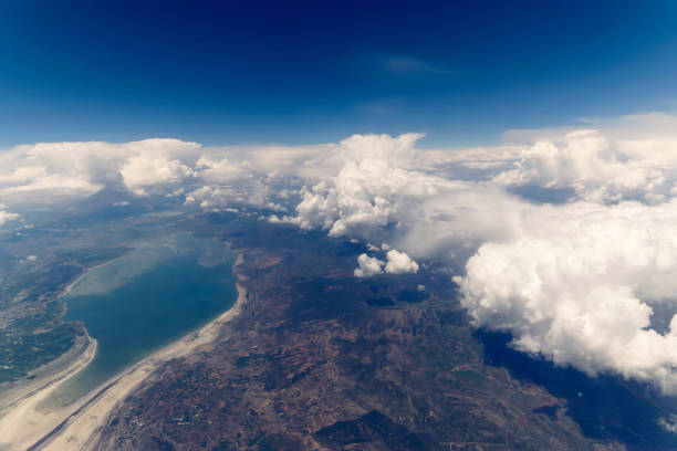 istock Clouds and Sky as Seen Through Window of an Aircraft 871831452