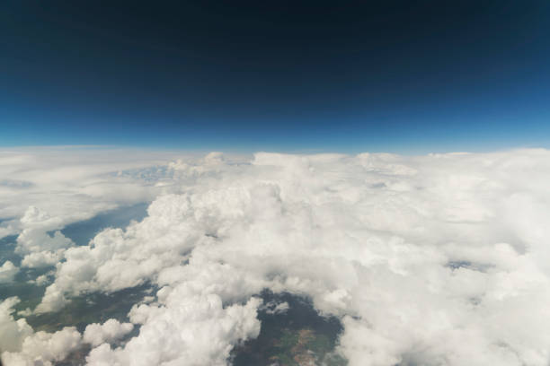 istock Clouds and Sky as Seen Through Window of an Aircraft 871831454