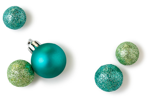 Beautiful, bright, modern Christmas holiday ornaments decorations in contemporary trendy blue and green colors with sparkling glitter on white background