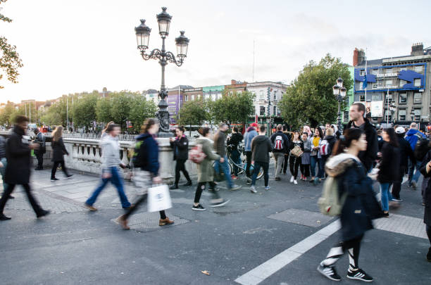 Crowd at the corner of Aston Quay and O'Connell Bridge in Dublin Ireland during day of autumn Crowd at the corner of Aston Quay and O'Connell Bridge in Dublin Ireland during day of autumn

 city street street corner tree stock pictures, royalty-free photos & images