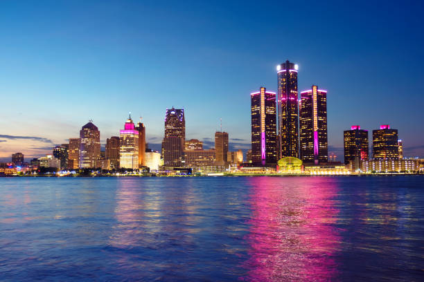 Detroit skyline reflected in water during sunset