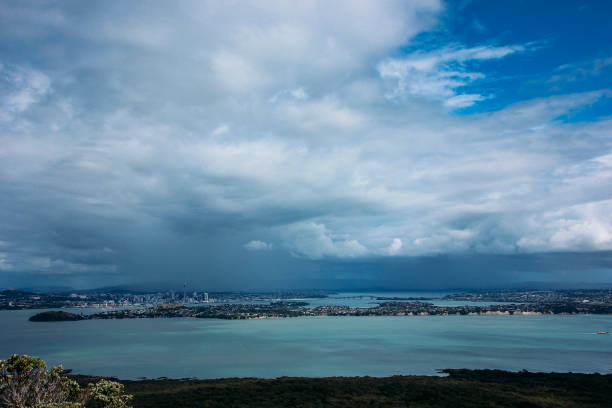 A storm cloud over the Auckland City skyline in New Zealand