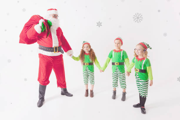 istock Santa's helpers working at North Pole. He Reading wishes list 871850442