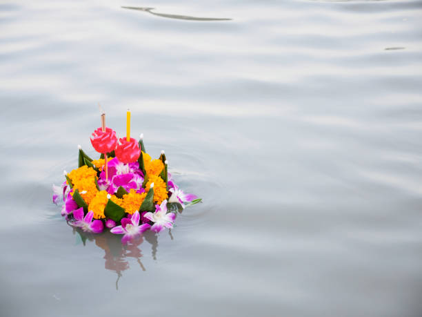 istock Krathong decorated with flowers in the evening 871850510